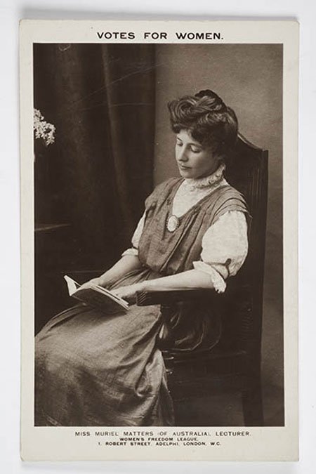 Postcard with photographic portrait of Muriel Matters. Above is printed 'Votes For Women'. Below is 'Miss Muriel Matters (Of Australia), Lecturer. Women's Freedom League' and the organisation's address. 