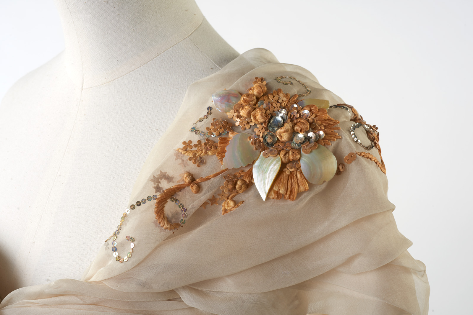The decoration on Princess Margaret's Dior dress.