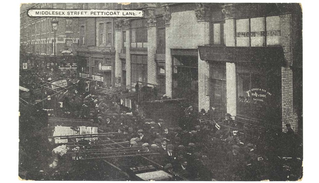 Petticoat Lane Market in Middlesex Street, east London, 1909-1910
A postcard showing crowds in Petticoat Lane, a centre for the manufacture and trade of garments. The area housed a high proportion of Jewish immigrants. (ID no.: NN16332)
