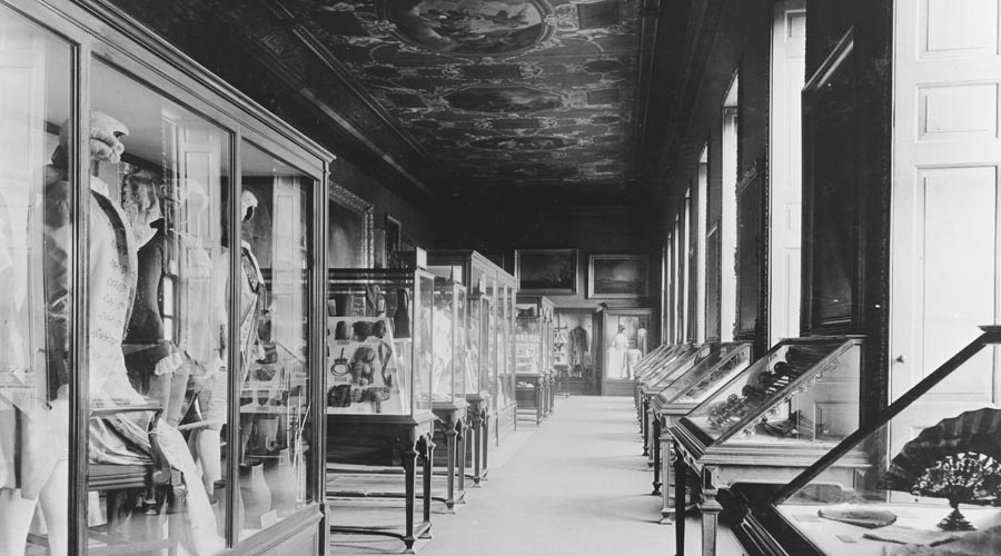 Historical and black and white image of exhibition cases 