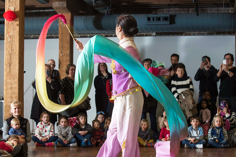 A person dancing with a ribbon at Museum of London Docklands