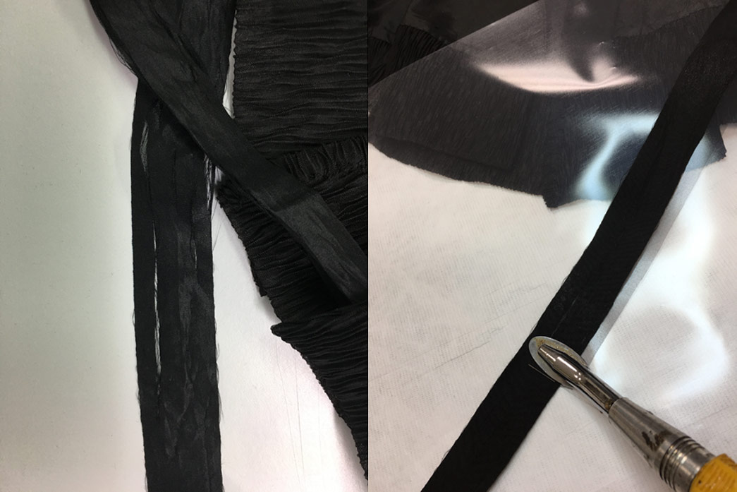 Close up of damaged grosgrain ribbon before treatment & heat setting the adhesive support