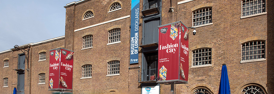 Exterior of Museum of London Docklands with Fashion City signage