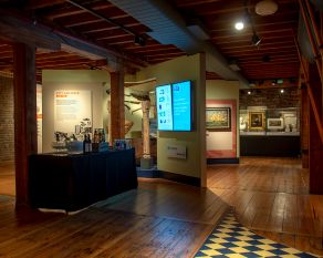 A drinks reception in the City & River gallery at Museum of London Docklands