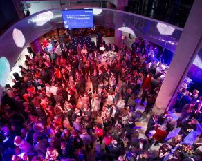 A drinks reception in Ellipse Hall at Museum of London